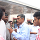 Lok Satta Party’s Jayaprakash Narayan speaks with voters at a polling booth in Malkajgiri even as a young volunteer with the party’s election symbol whistle marked on his temple listens intently.